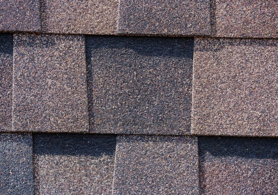 Close-up of layered architectural asphalt shingles.